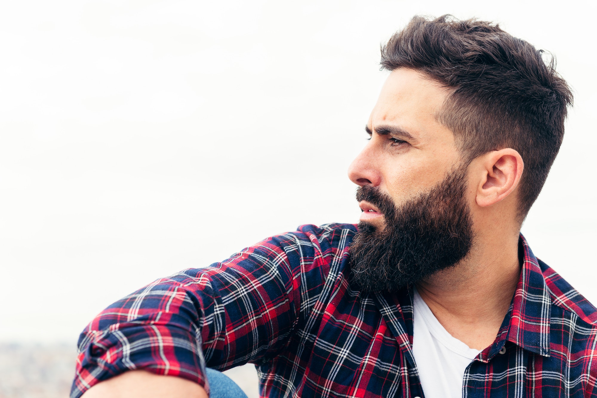 profile portrait of a handsome bearded man