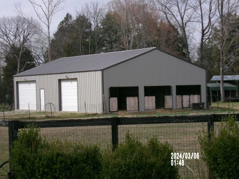 40’x60’x18’ Stable with 2 14x14 roll up doorsRed iron column frame
26 gauge roof
26 gauge wallsWickliff KY approx  location
2-14’x14’ roll up door
3” roof and wall insulation insulation
1-3070 steel walk doors
3- 12x10 openings on endwall