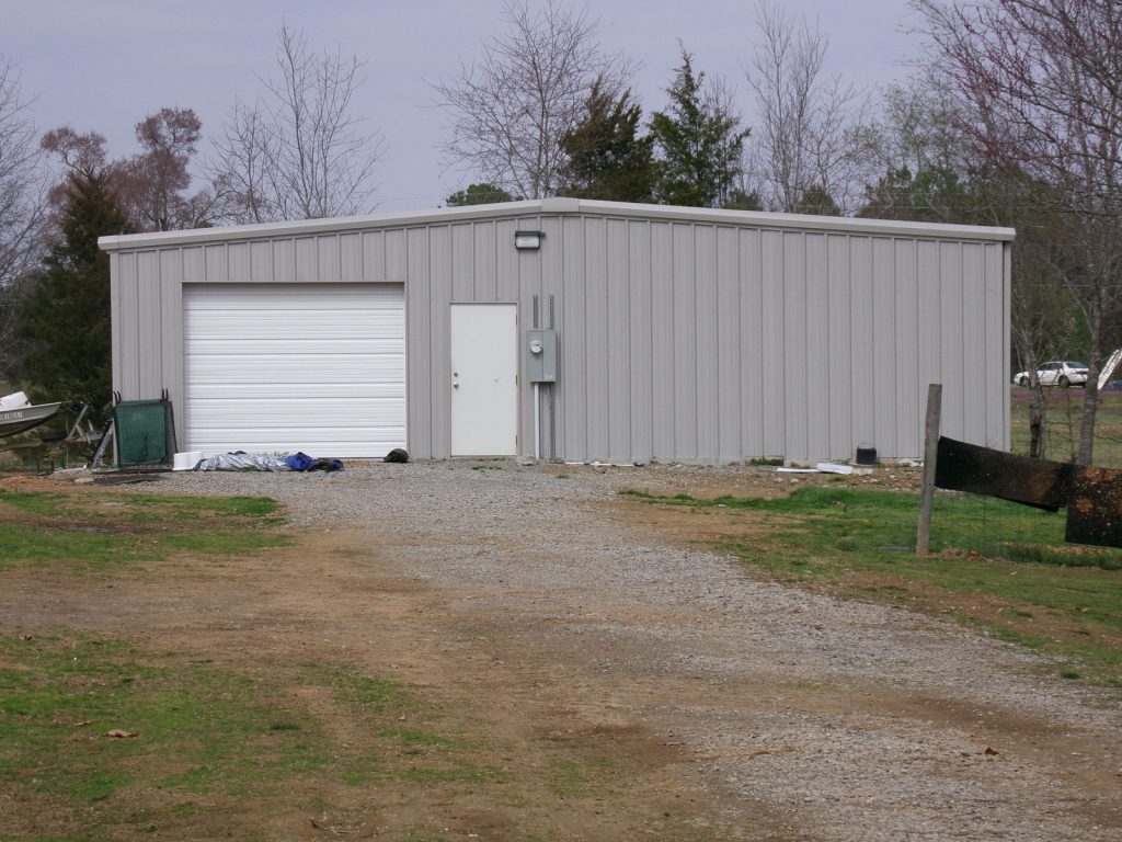 gray-storage-building-with-garage
Work shop
Red iron column frame
26 gauge roof
26 gauge walls
Gutters and downspouts

Wichita kansas approx  location
1-12’x12’ roll up door
3” roof and wall insulation insulation
1-3070 steel walk doors